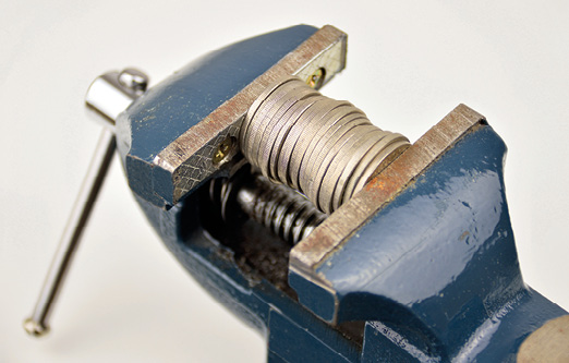 Coins squeezed to represent margins 