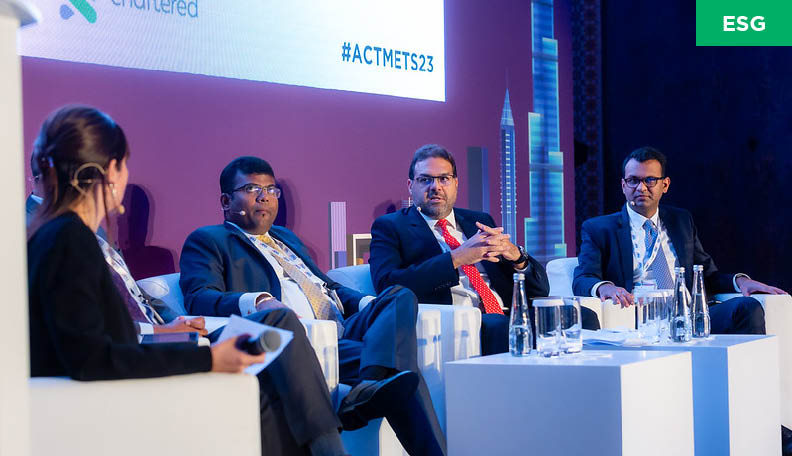 Nader Aboushadi (second from right) and Vishal Tikyani (far right) address the Middle East Treasury Summit