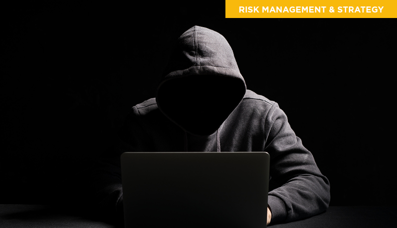 hacker-working-on-laptop-in-the-dark