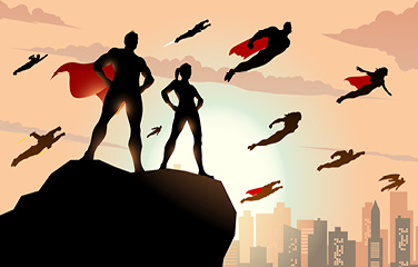 Superheroes in capes standing on a cliff