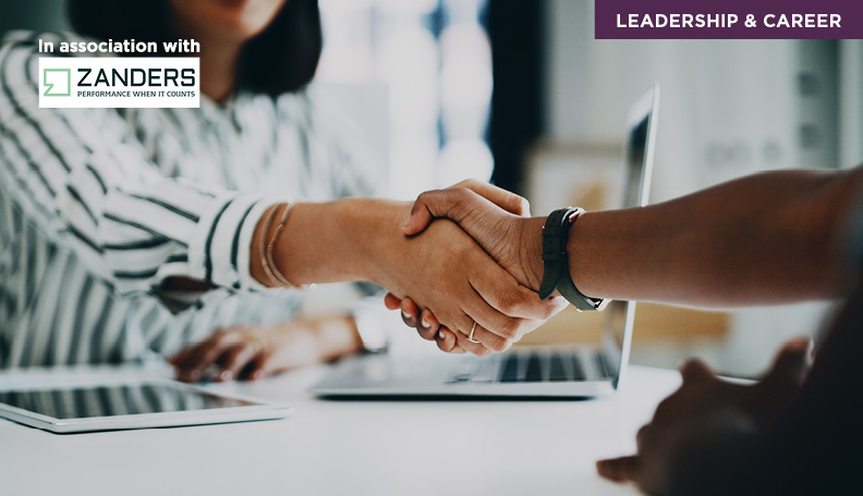 shaking hands with a logo of Zanders