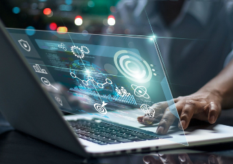 image of man at laptop with digital icons demonstrating web resources