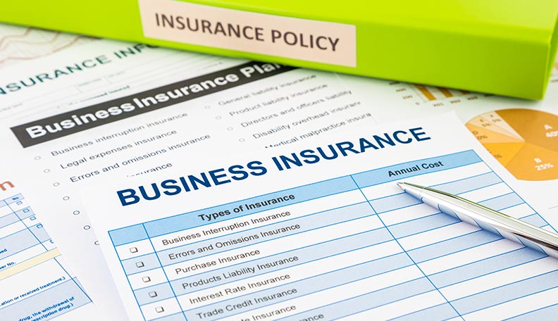 ”Image of business insurance folders and documents”