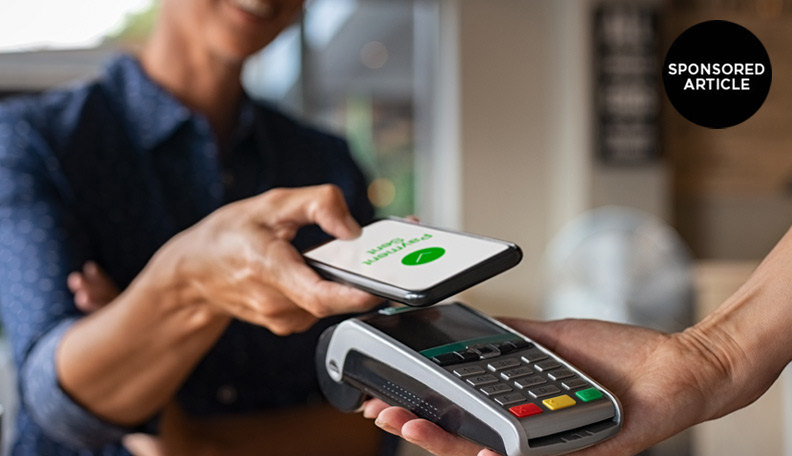 Image of someone making a payment using a smartphone