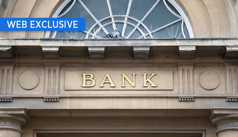 Image of a bank exterior, focusing on the word ‘BANK’ above the entrance