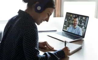 Treasury student studying with an online tutor.