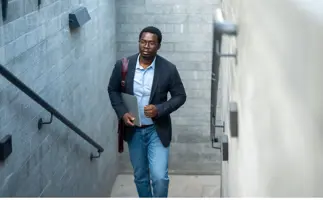 Man walking up the stairs, concept showing him moving toward future career opportunities