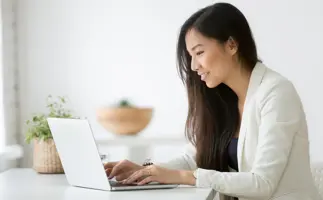 A professional on their laptop